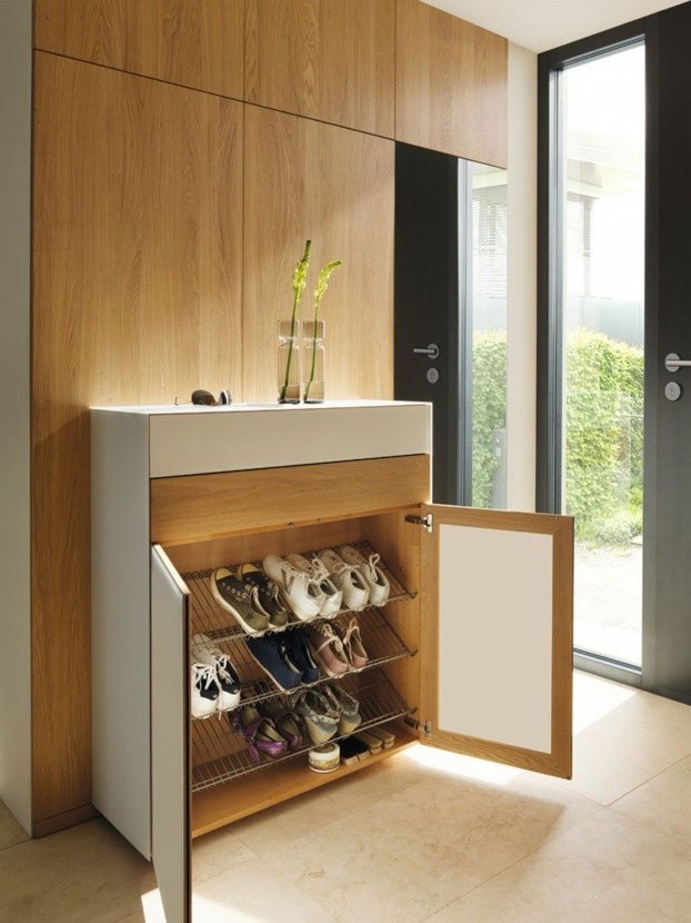 A shoe rack in the foyer