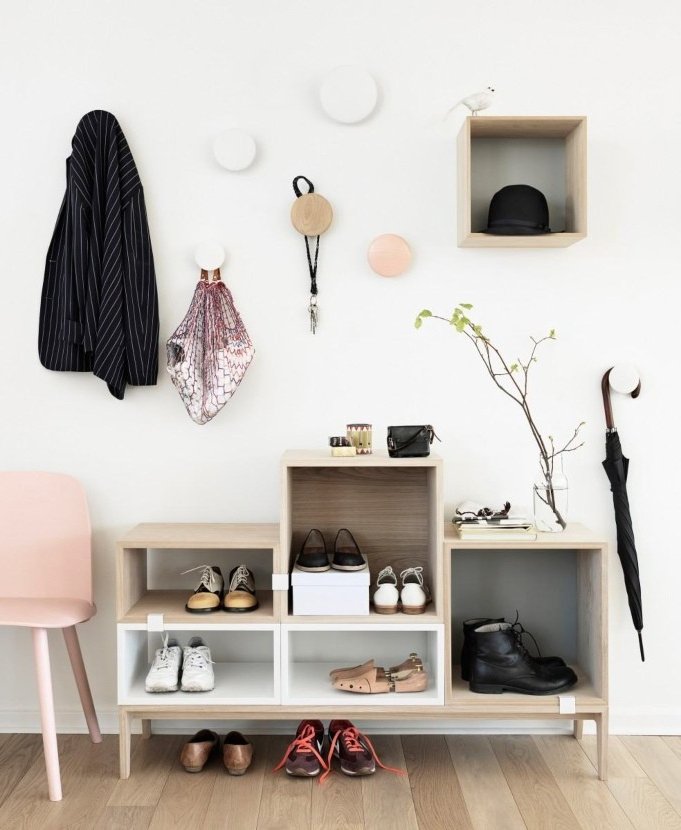 shoe rack at different heights in the hallway